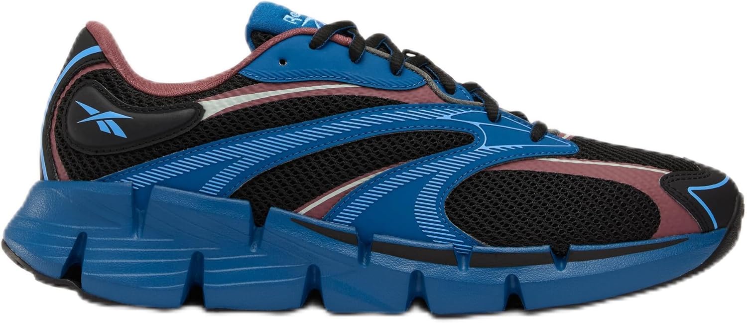 Pavo Monitor Arm installed on a wooden desk with cables organized